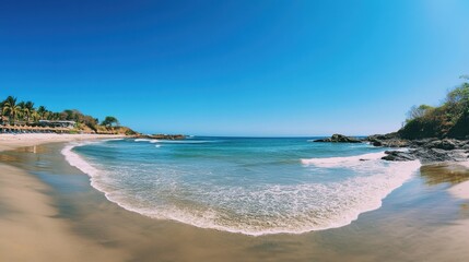 Obraz premium Serene beach cove with gentle waves.