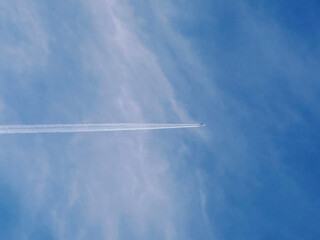 Airplane contrails on blue sky