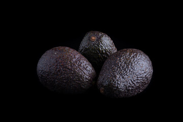Three Avocados on Black