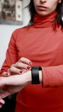 Woman checking smartwatch during workout