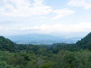 Obraz premium Aerial photo overlooking the city from the top of a mountain in Komagane City, Nagano Prefecture, Japan