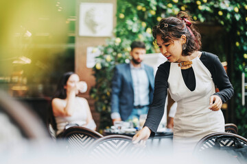 A diverse group of professionals brainstorm ideas in a modern coffee bar. Engaged individuals collaborate and discuss strategies in a relaxed, stylish environment.