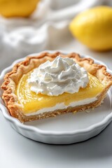 Slice of lemon tart with whipped cream on white plate