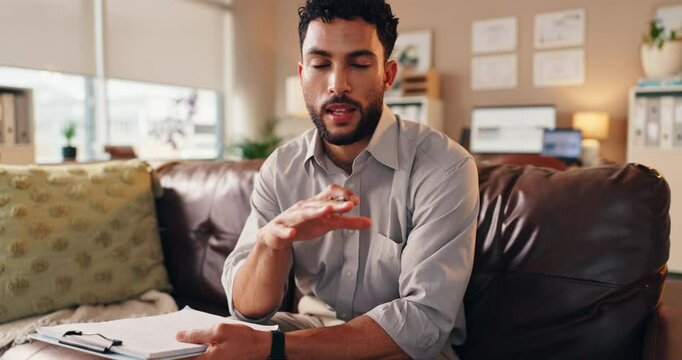 Psychologist, face and video call for online therapy in office with clipboard, mental health support or advice. Doctor, man and virtual consultation for telehealth, counseling or professional service