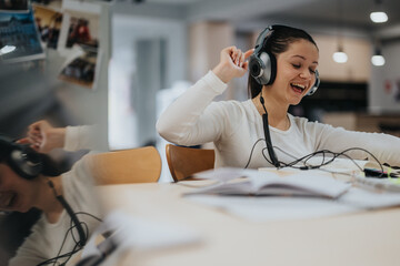 Young woman wearing headphones and expressing happiness while listening to music. She is relaxed and absorbed in her own world, creating a joyful and vibrant atmosphere.