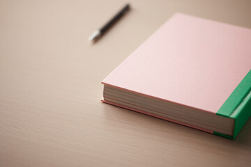 A comfortable workspace. A wooden desk with various objects.