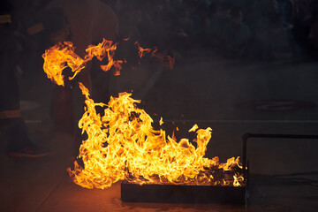 Cropped view of people in fire extinguishing approach training