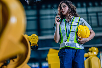 Woman Supervising Production With Communication Device in Industrial Setting