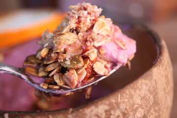 Enjoy a Delicious Granola Topping on Smooth and Creamy Pink Yogurt