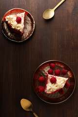 Pieces of red velvet cake on plates on wooden background, top view