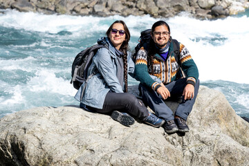 latin travelers couple in chile Saltos del Petrohue. Travelers in Chile. Lake District. Patagonia