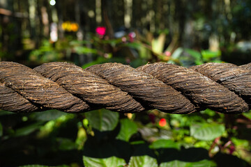 Fototapeta premium Think and braided rope made from natural fiber with bokeh background