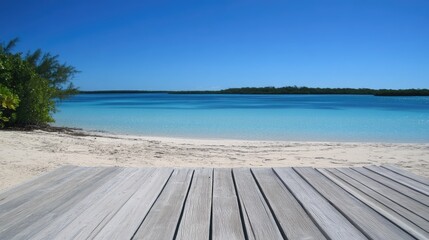 Obraz premium Tranquil Tropical Beach with Clear Water and Wooden Deck View