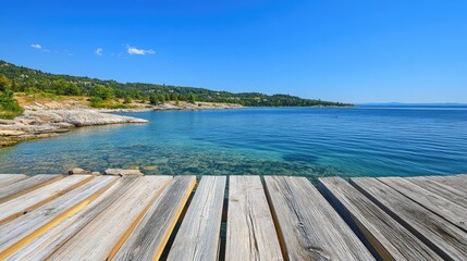 Obraz premium Serene Lake View from Wooden Pier with Clear Blue Sky and Water