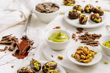Preparing exquisite dessert, dates filled with pistachio mousse, alternative to popular Dubai chocolate bar