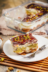 Homemade tiramisu with pistachio mousse and dark chocolate