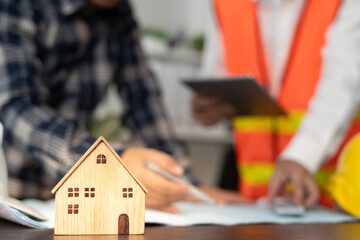 inspector engineer and owner project is inspecting construction and quality assurance new house. Engineers or architects or contactor work to build the house before handing it over to the homeowner