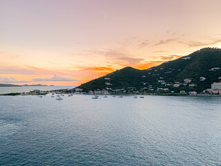 Ocean island sunset over the water