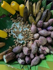 Traditional healthy snacks menu for parties in Indonesia, there are sweet corn, stewed peanuts, potatoes, bananas and breadfruit fresh from steamer.