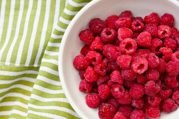Fresh raspberry in a white bowl