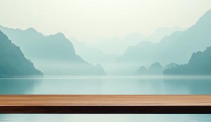 Wooden table with misty mountain lake background.