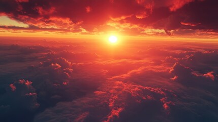 A breathtaking sunset fills the sky with vibrant hues as the sun dips below the horizon, casting warm light over expansive clouds below, creating a serene atmosphere.