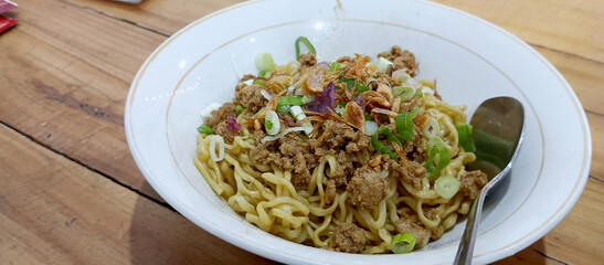 A bowl of yamin chicken noodles