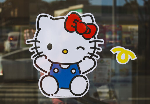 Tokyo, Japan - December 17, 2024 - A sticker of the Sanrio  character "Hello Kitty" at a Baskin Robbins shop in Tokyo. It is an advert for a Hello Kitty Collaboration for the 50th anniversary.
