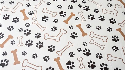 A delightful pattern of dog bones and paw prints on a light background