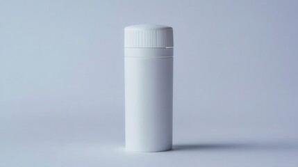 White cylindrical container standing upright on gray surface with soft shadow and minimal design