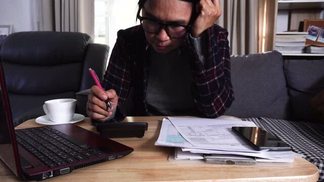 Budget and Tax planning concept. Accountant hand using calculator and review tax forms. Represents personal finance, tax preparation, budgeting, and season to pay tax.