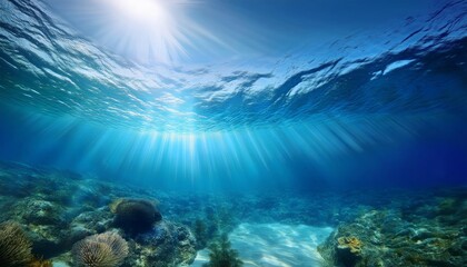 Fototapeta premium Tranquil underwater scene with sunlight rays piercing the deep blue ocean