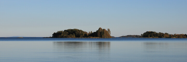 Small islands covered by forest in Lake Vanern, Sweden.