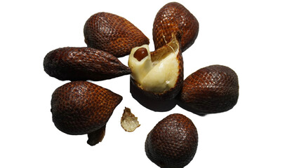 Close-up of snake fruit against white background