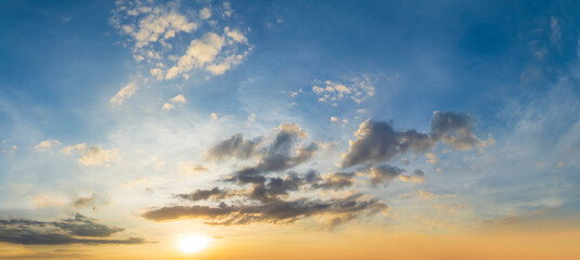Wide angle shot of golden hour sky and evening sun.