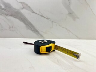 tape measure on a wooden background