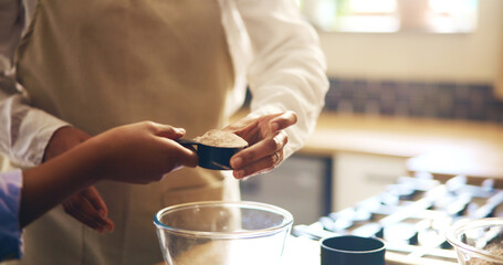 Hands, parent and kitchen with mixture for baking for Christmas dessert, cake and meal prep at home. People, learning and teaching or helping for culinary skill with child development and growth