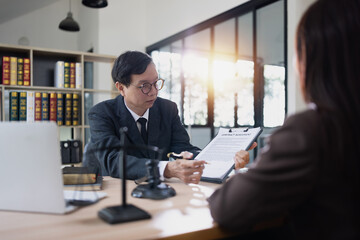 Fototapeta premium Lawyer or judge consult, lawyers discussing about contract and agreement concept.