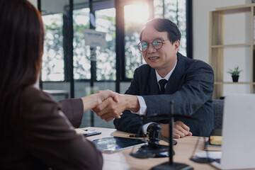 Lawyer man shaking hands with customer, Contract agreement, Lawyer or judge consult.