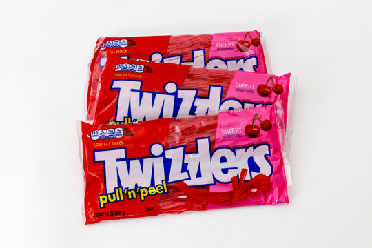 March 6, 2023. Spartanburg, SC USA. Twizzlers participants savor cherry pull and peel candy during a fun summer gathering in a backyard.