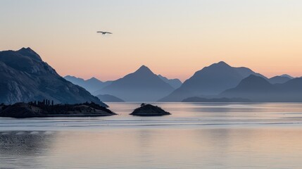 Fototapeta premium Serene sunrise over calm lake and majestic mountains, a bird in flight.