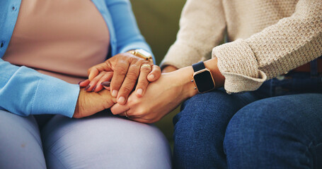 Senior woman, friend and holding hands for empathy in home with grief, support and compassion for...