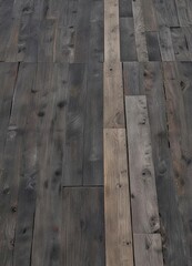 Weathered wooden planks on a dark gray rough grainy sand surface, erosion, beach, wooden planks