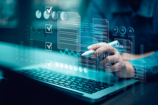 Businessman using computer for development and Analytics Data technology management System for report marketing strategy planning. graph analysis and information on a futuristic virtual screen.