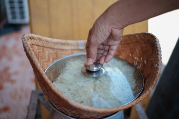 Close up of the steam sticky rice in wooden steamer.glutinou rice , northeastern of thailand food