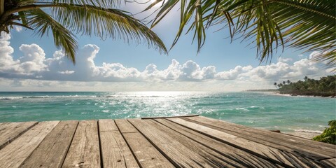 Fototapeta premium Serene Coastal View from a Weathered Wooden Deck, Overlooking a Sparkling Ocean and Lush Tropical Vegetation