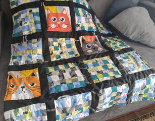 Bright baby quilt made of colorful patchwork 