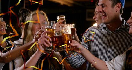 Image of gold stars over friends making toast and partying