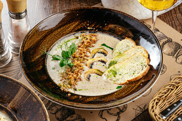 cream of mushroom soup with croutons and greens