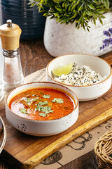 Thai spicy tom yum soup with rice and shrimp